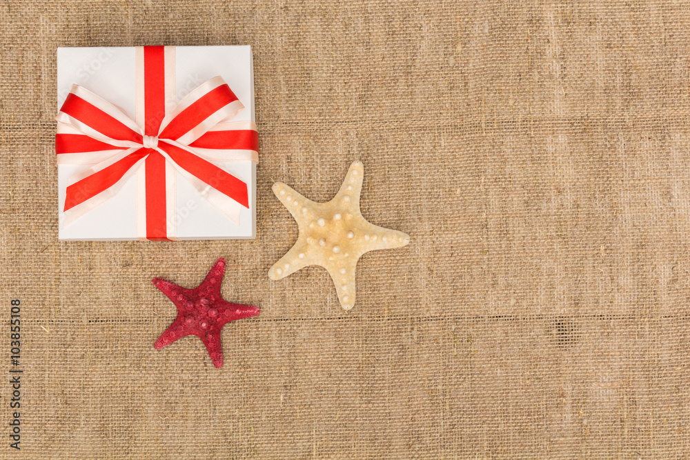 tarfish and a gift lying on sackcloth tarfish and a gift lying on sackcloth