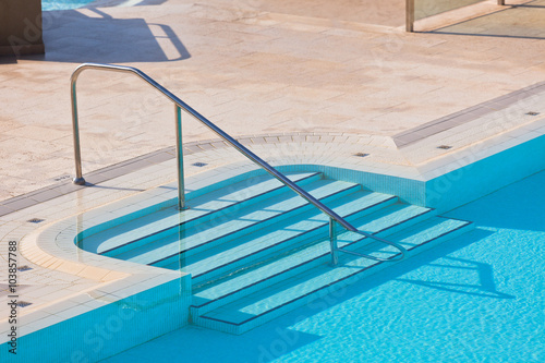 Outdoor Swimming pool with staircase © dvoevnore