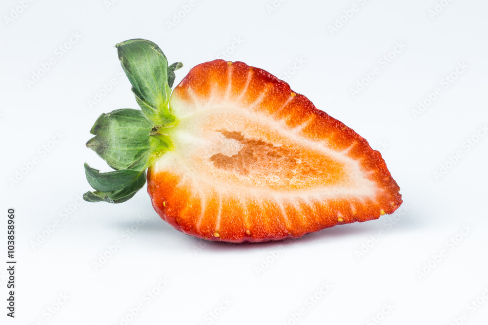 Half of strawberry isolated on white background Half of strawberry isolated on white background