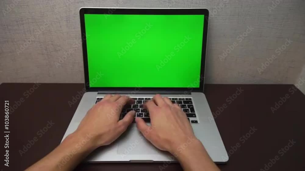 Male hands typing on a laptop is very fast