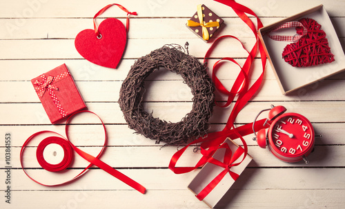 Fotografie wreath, clock, gifts and frippery lying on the table