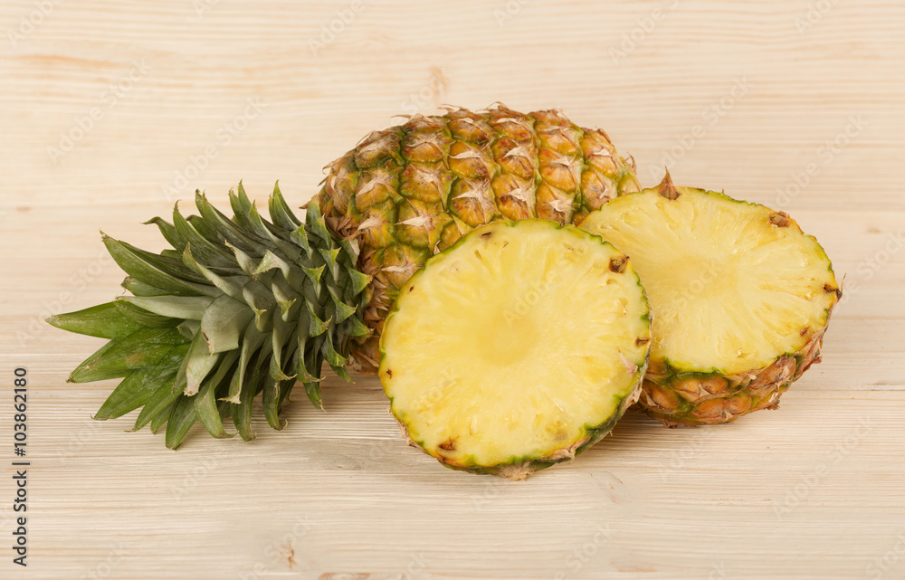 pineapple on a wooden background pineapple on a wooden background