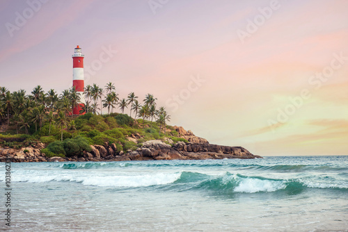 Lighthouse on the cliff in Kovalam Beach