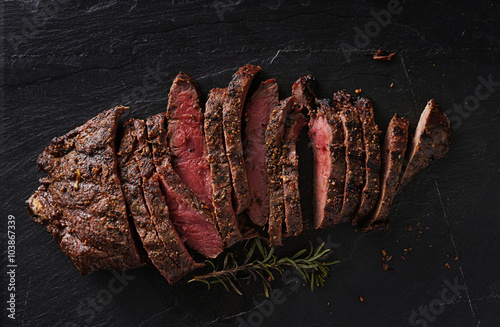 grilled flat iron steak shot in flat lay style from overhead