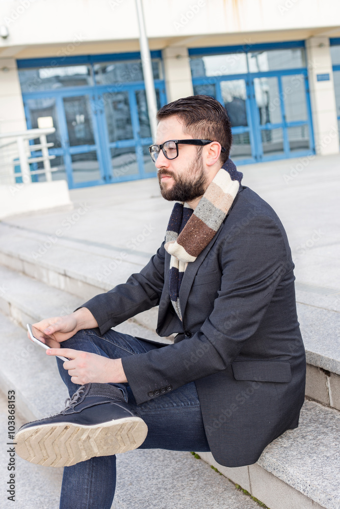 young businessman using tablet