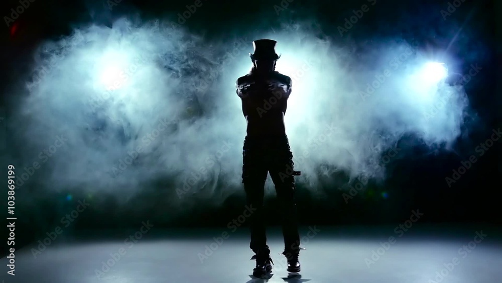 Erotic show of man, go on dance and spin in smoke, on black, slow motion Erotic show of man, go on dance and spin in smoke, on black, slow motion