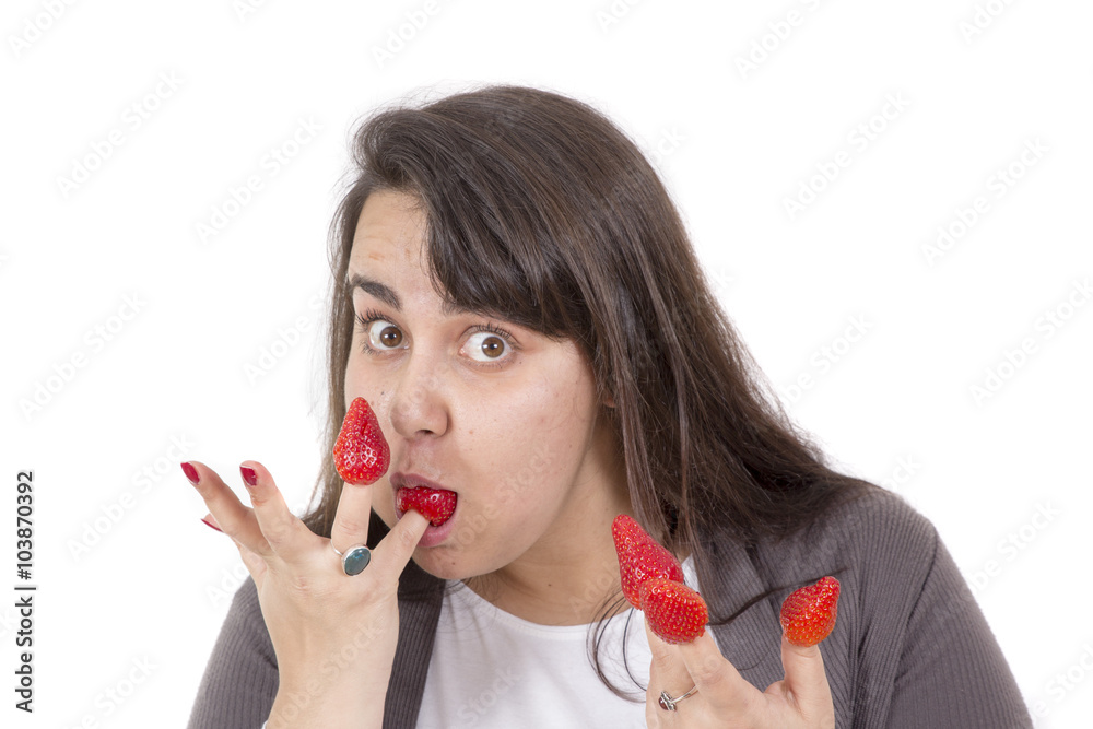 fat woman holding strawberryies on fingers and look funny fat woman holding strawberryies on fingers and look funny