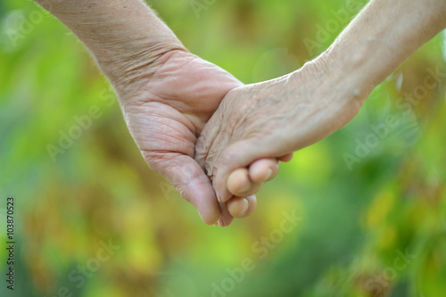 Elderly couple holding