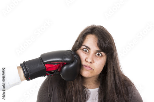 fat woman getting hit in the face by boxing glove. White background.