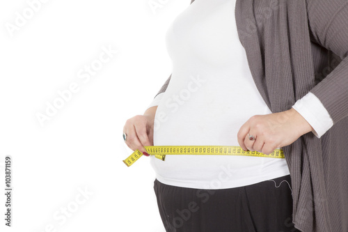 Pretty large, fat girl with a measuring tape isolated on white