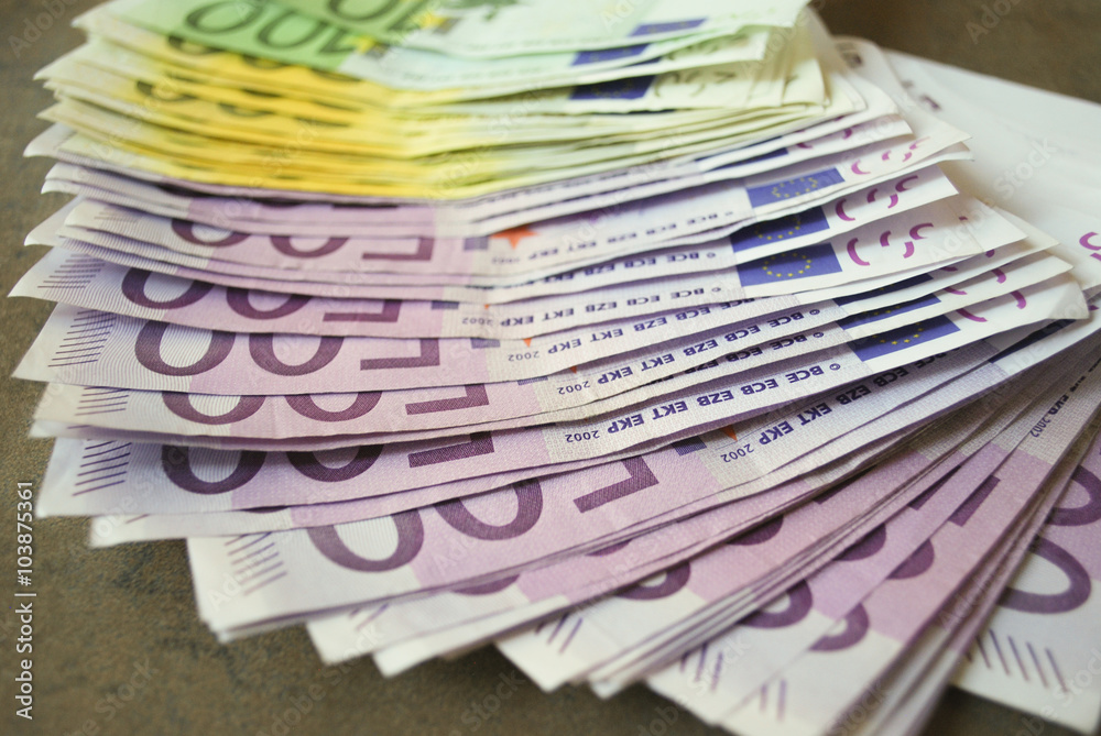 Cash Euro banknotes spread out on the table. Cash Euro banknotes spread out on the table.