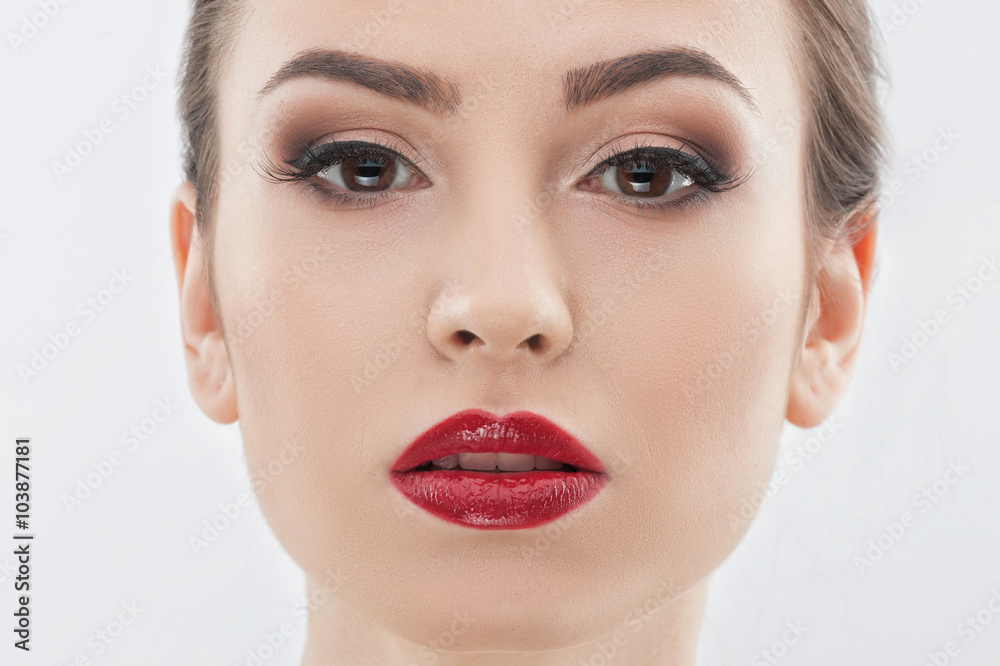 Attractive young girl with cosmetic on face Attractive young girl with cosmetic on face