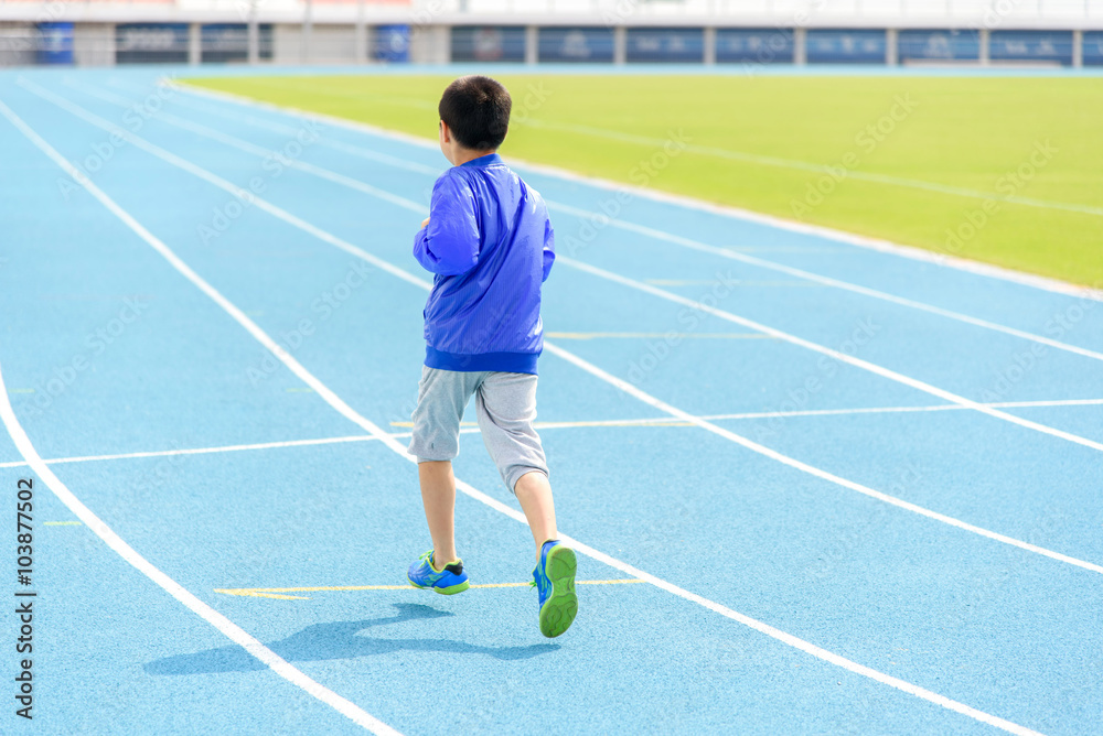 Boy run in blue track