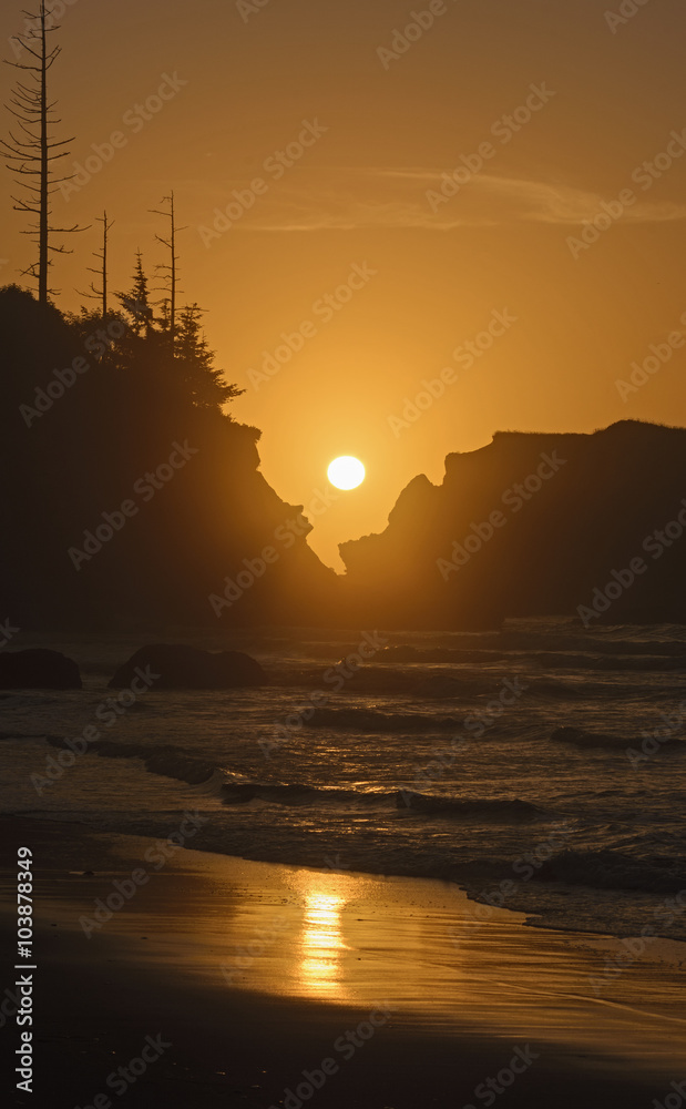 Setting Sun Through Coastal Rocks