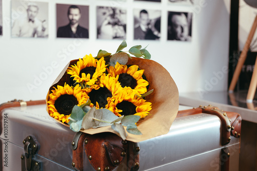 Fototapeta Naklejka Na Ścianę i Meble -  Bouquet of sunflowers in a paper wrapper
