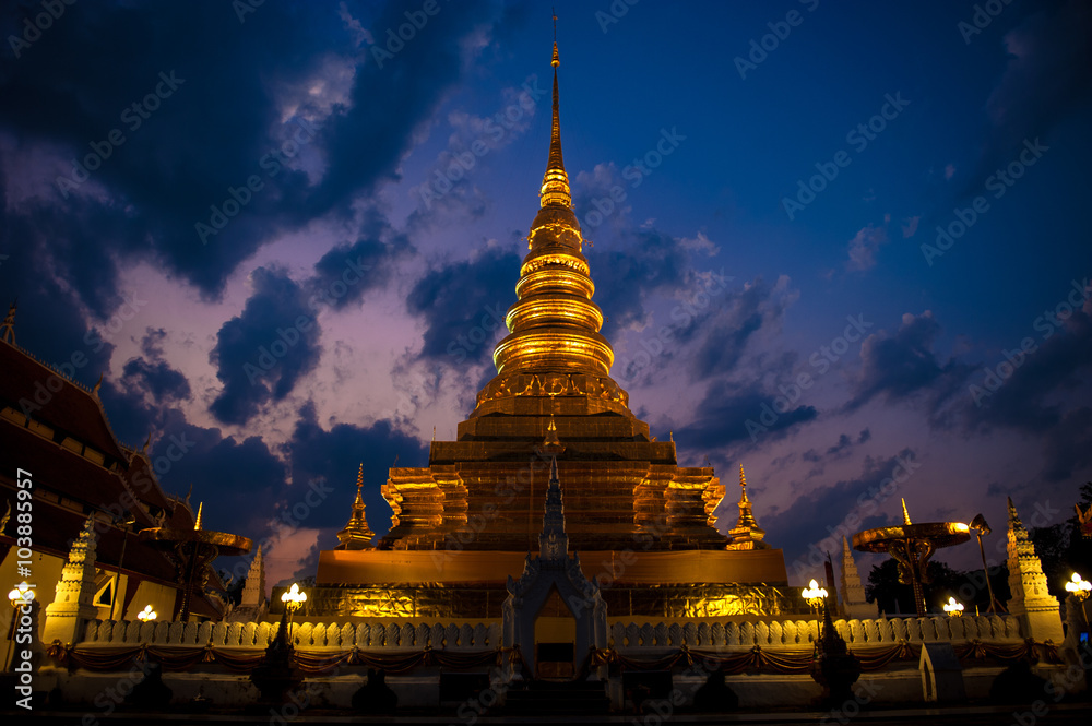 Fototapeta premium The golden temple Landmark of Nan is Wat Phra That Charehang was built in 1355. It is the most sacred wat in Nan Province Thailand