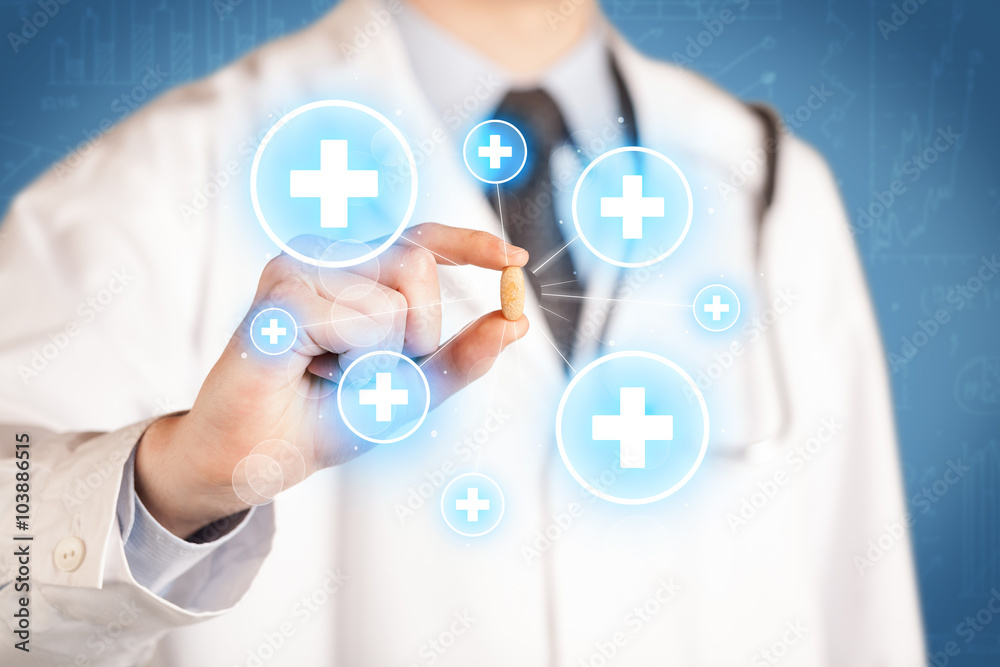 A doctor showing a pill with crosses A doctor showing a pill with crosses