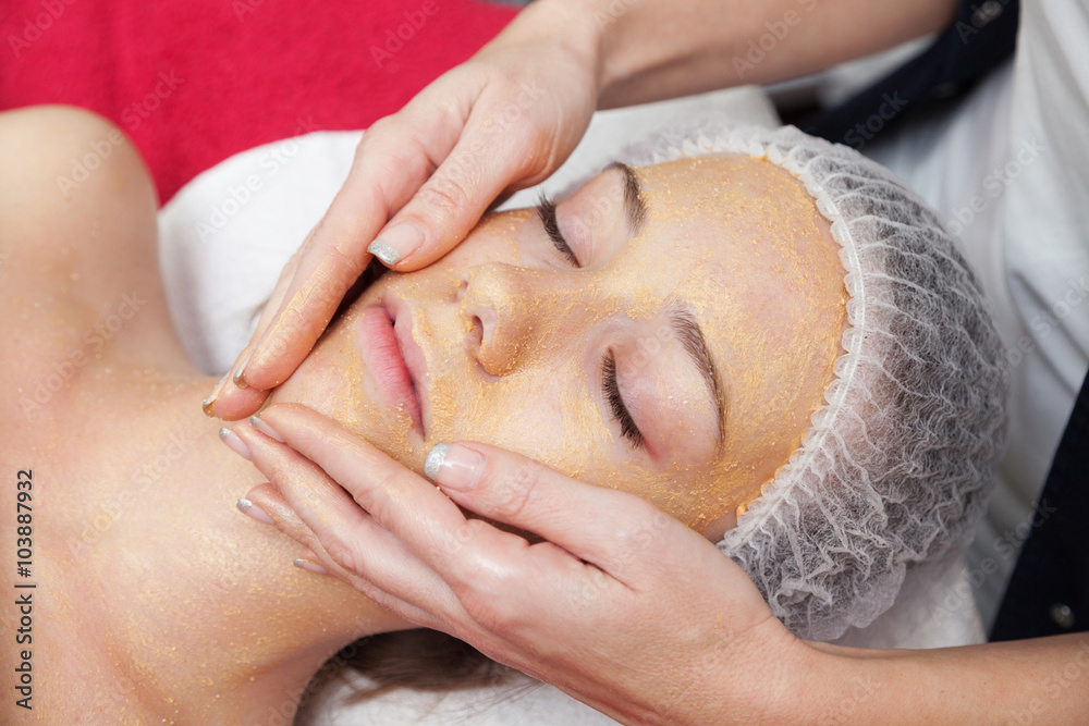 Woman having facial mask at beauty salon Woman having facial mask at beauty salon