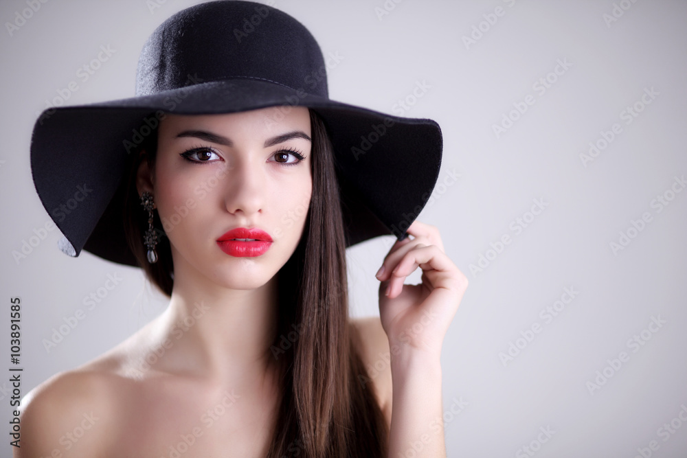 Attractive young woman in hat