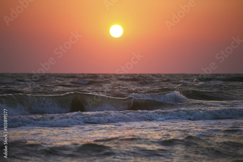 Bright sunset over the sea photo