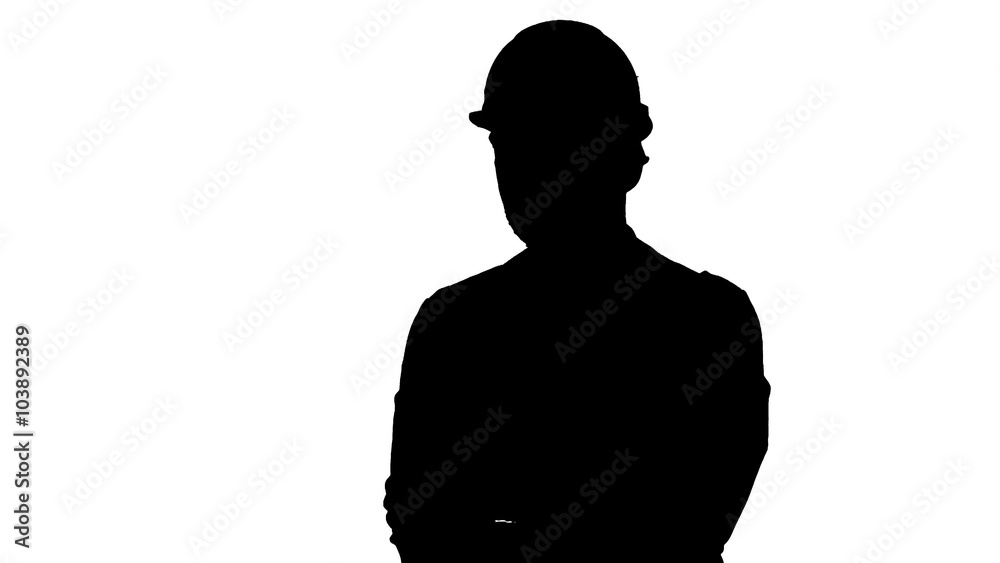 Silhouette Construction worker looking at his watch. Builder waiting for a meeting track matte. Silhouette Construction worker looking at his watch. Builder waiting for a meeting track matte.