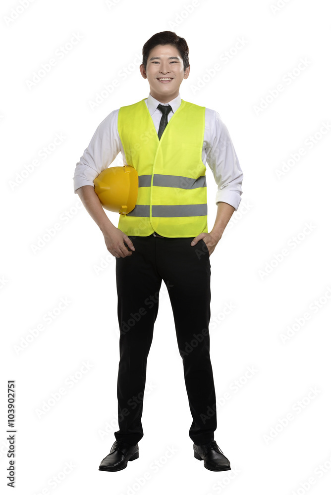 Asian worker wearing safety vest and yellow helmet Asian worker wearing safety vest and yellow helmet