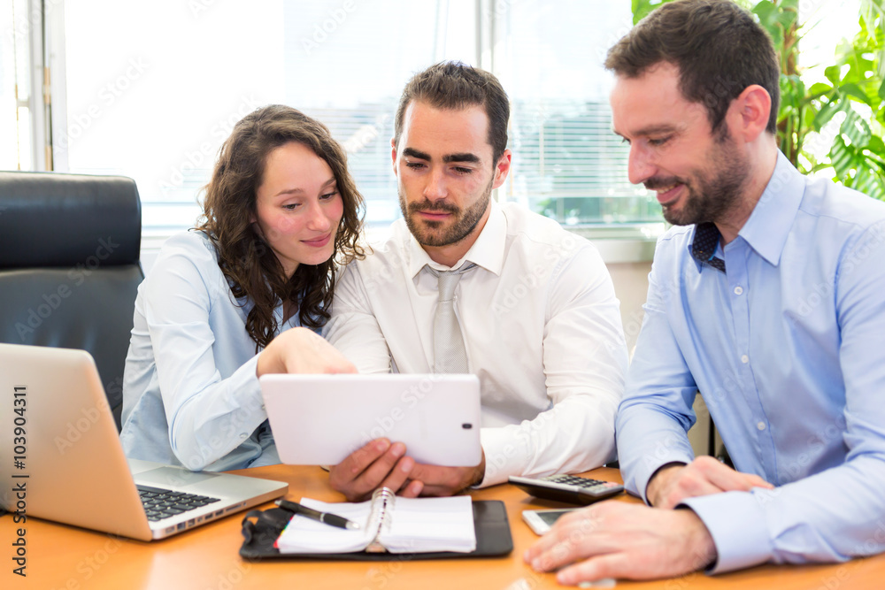 Group of business associates working together at the office Group of business associates working together at the office