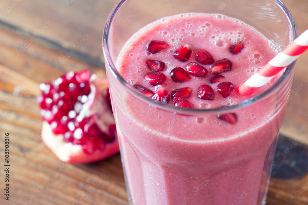 pomegranate smoothie on wooden background pomegranate smoothie on wooden background