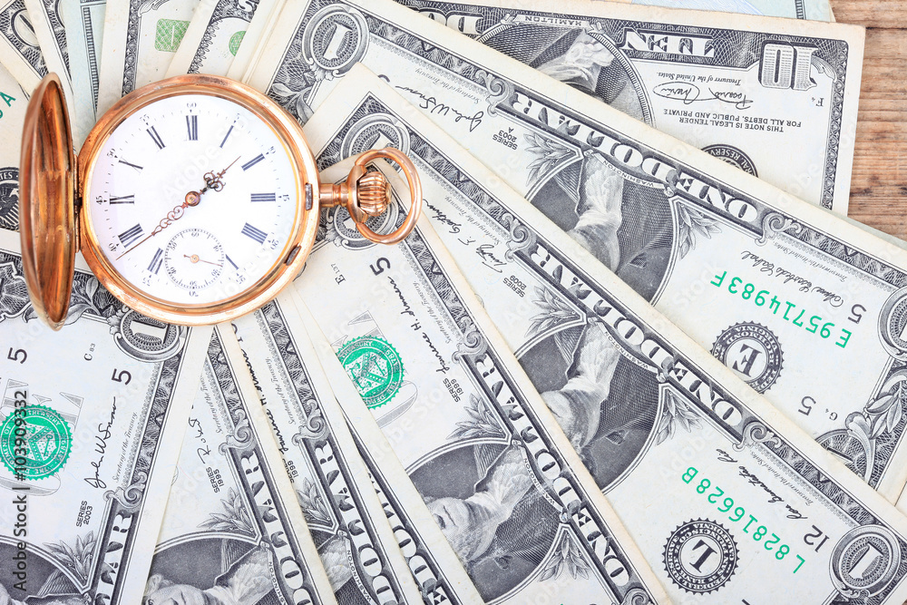 watch and dollar bills background watch and dollar bills background