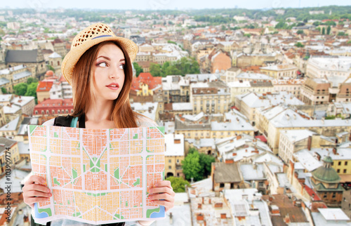 Traveler with map on city b...