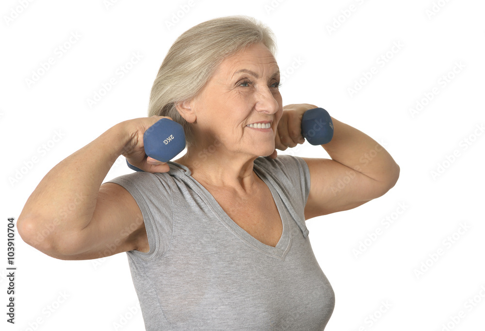 Senior woman exercising with dumbbells Senior woman exercising with dumbbells