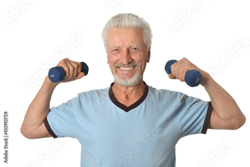 Senior man Standing With Dumbbell