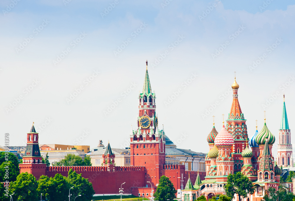 Spasskaya Tower and St. Basil's Cathedral on Red square in summer day. Moscow. Russia