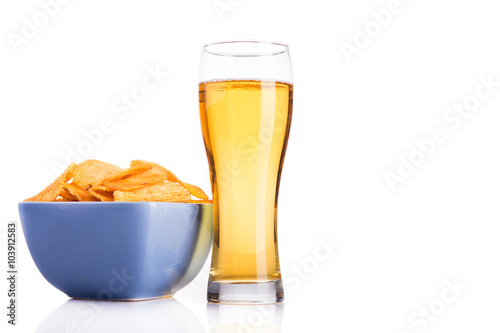 Glass of beer and chips isolated