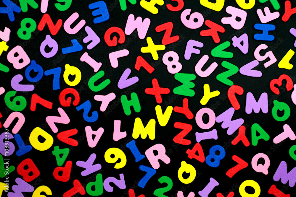 Colorful letters and numbers on black background. Colorful letters and numbers on black background.