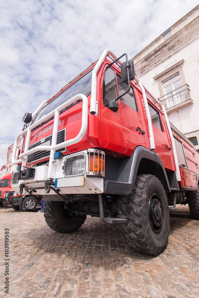Wide perspective view of several fire trucks parked in Faro city, Portugal.