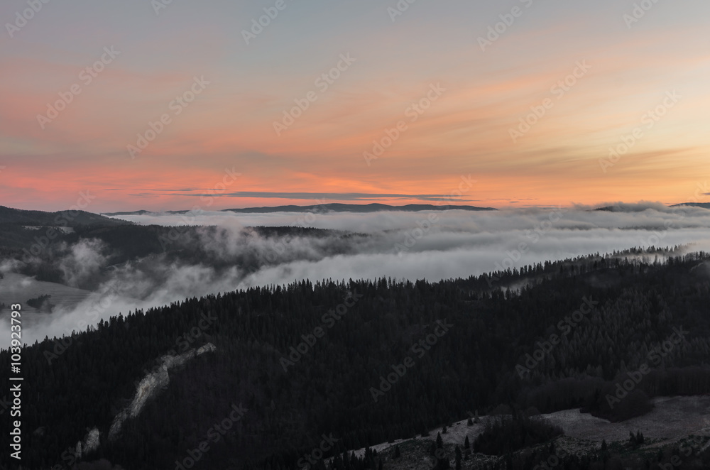 Carpathian mountains in the clouds, sunrise seen from Wysoka mountain in Pieniny, Poland