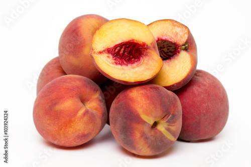 sweet peaches isolated on a white background.