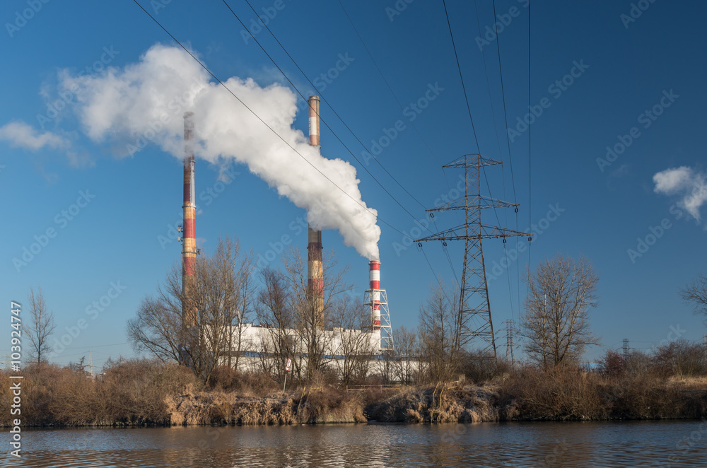Power plant at cold morning over Vistula river, Krakow, Poland Power plant at cold morning over Vistula river, Krakow, Poland