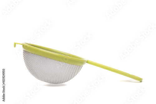 Fotografija Round metal strainer isolated on white background.
