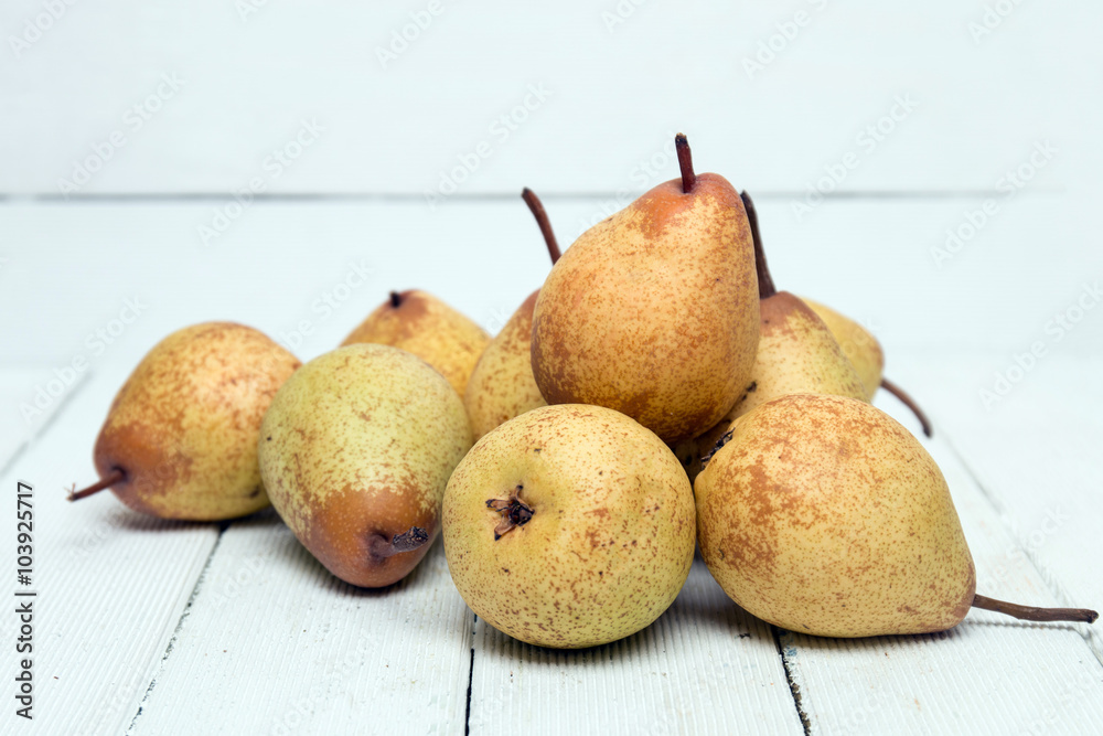 Fresh tasty yellow pear fruits isolated on a white background. Fresh tasty yellow pear fruits isolated on a white background.