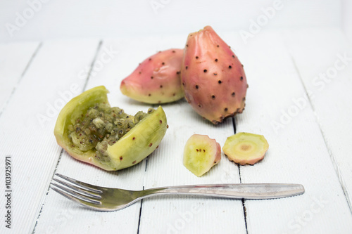 Opuntia ficus-indica cactus fruits opened on a white background photo