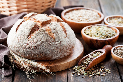 Whole grain bread with seeds of sunflower, pumpkin, flax and hemp, selective focus