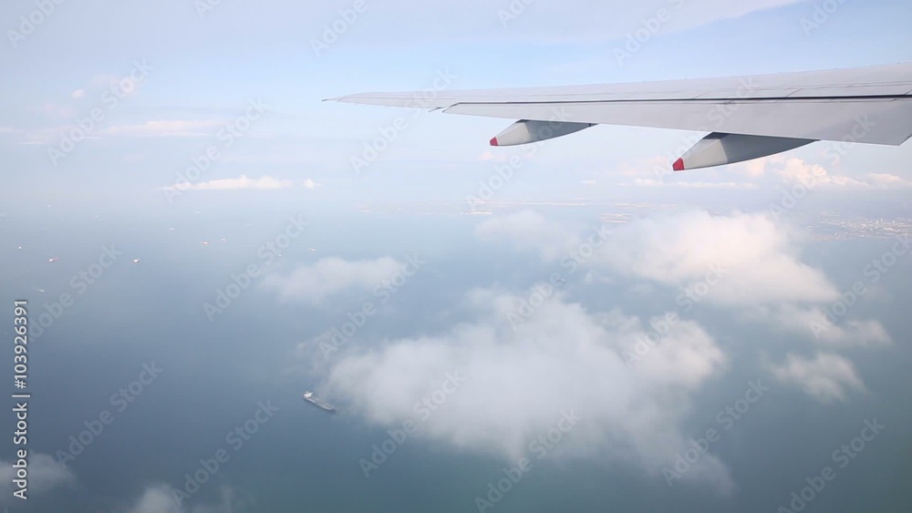 Traveling by air. View singapore bay through an airplane window. Traveling by air. View singapore bay through an airplane window.
