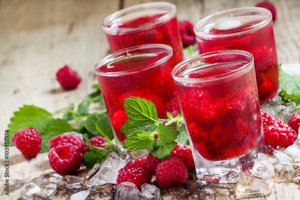 Refreshing raspberry drink with berries, ice and mint, selective Refreshing raspberry drink with berries, ice and mint, selective
