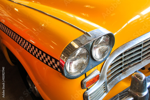 Yellow Cab Taxi, Color detail on the headlight of Taxi Checker