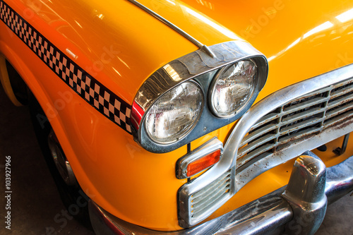 Yellow Cab Taxi, Color detail on the headlight of Taxi Checker © wittayayut