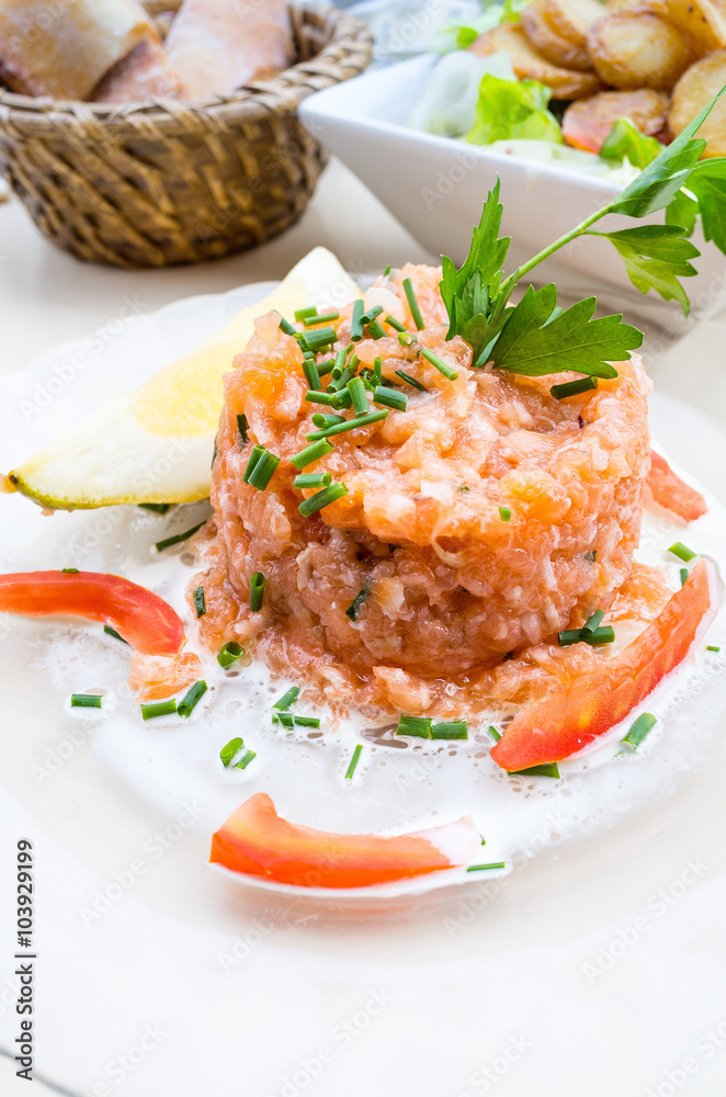 tasty Steak tartare (Raw beef) - classic steak tartare on white tasty Steak tartare (Raw beef) - classic steak tartare on white