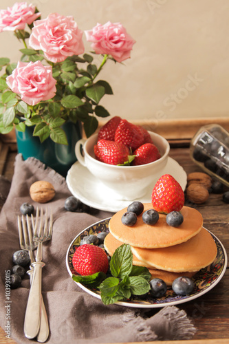 pancakes with strawberries and blueberries for breakfast