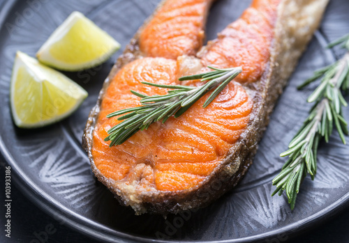 Roasted trout steak with fresh rosemary